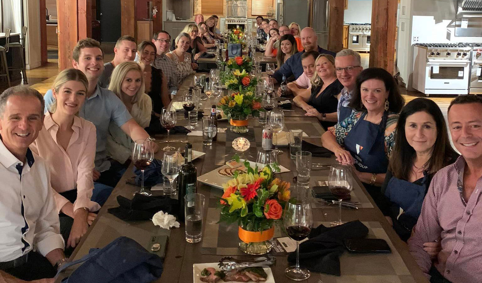 buffalo-event-space_wide A group of people sitting at a table with wine glasses.